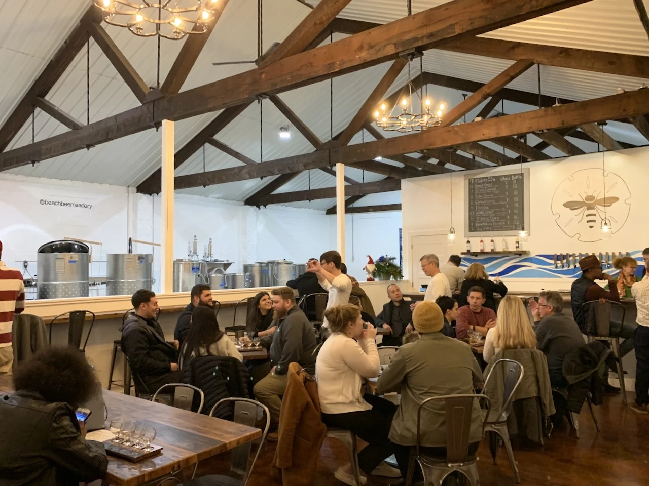 Crowd celebrating the Beach Bee Meadery grand opening in New Jersey with craft mead and hard cider